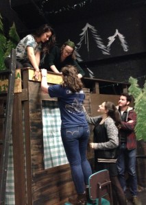 The cast and crew puts finishing touches on the set.